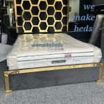 The modern bedroom bedframe plush gold stripes