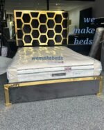 The modern bedroom bedframe plush gold stripes